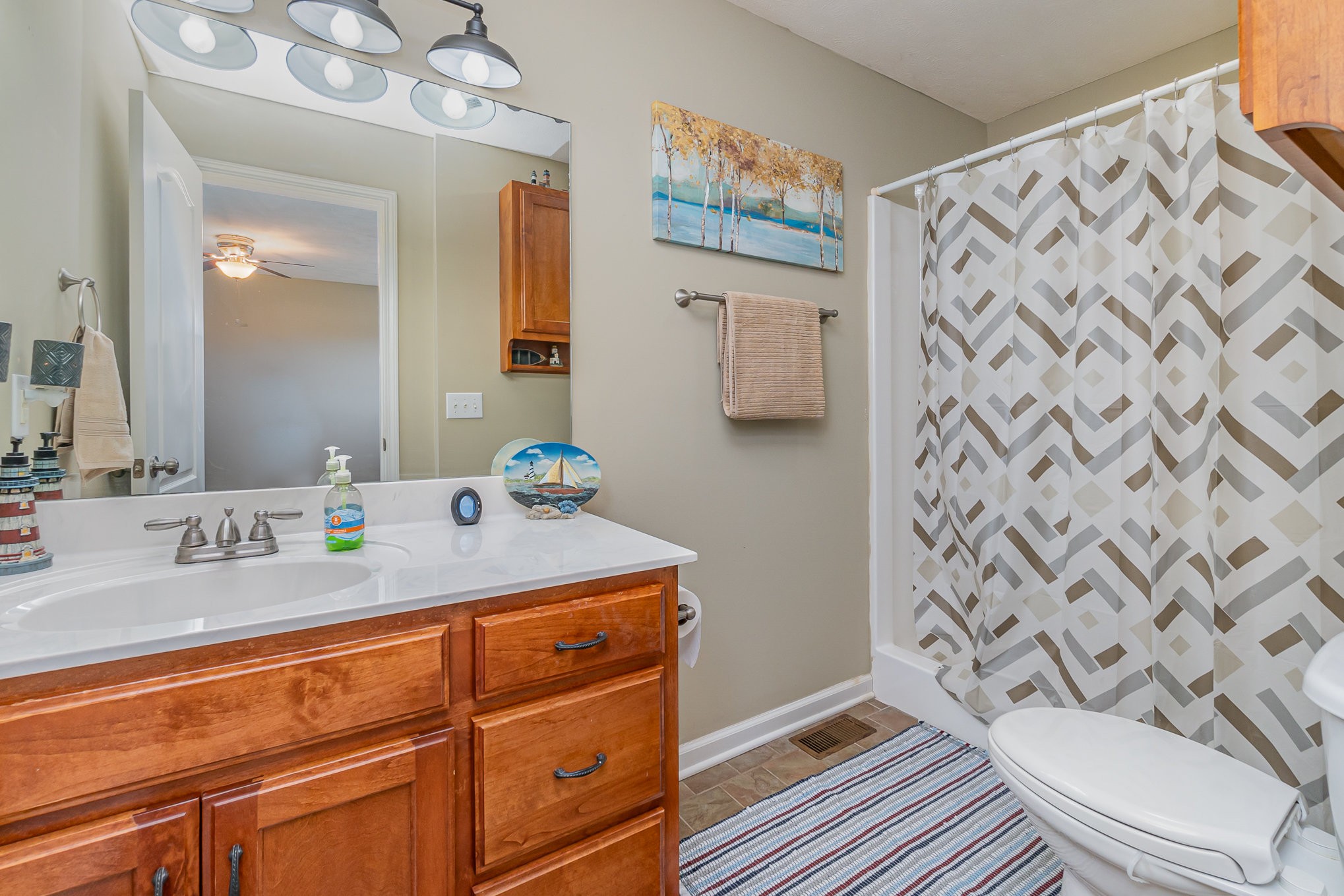 4120 Woodrow Wilson Road Springfield, TN 37172 - Photo 18 of 38 a bathroom with a granite countertop sink and a mirror
