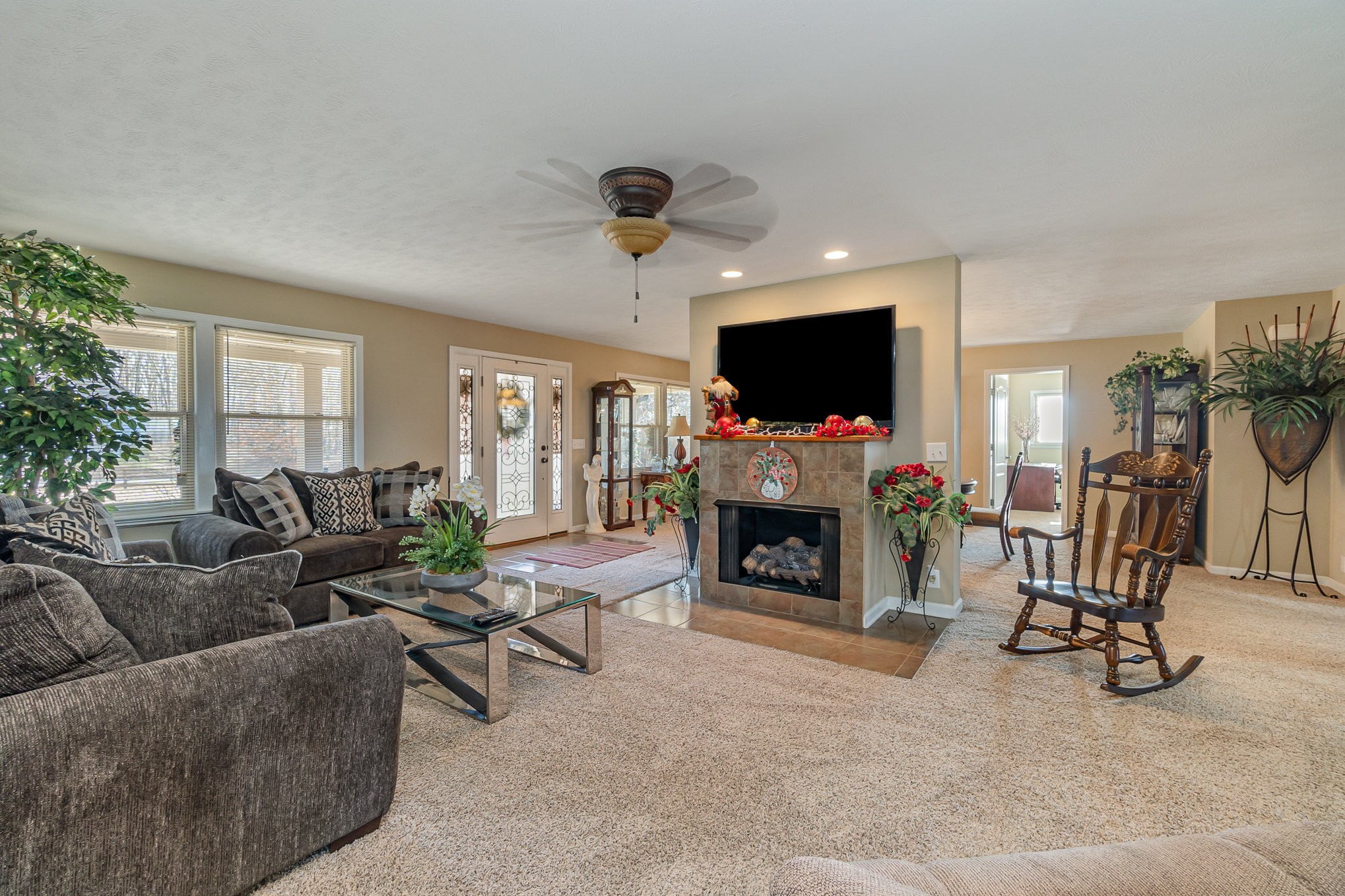 4120 Woodrow Wilson Road Springfield, TN 37172 - Photo 3 of 38 a living room with furniture a fireplace and a flat screen tv