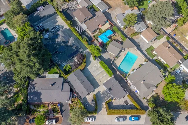 an aerial view of a house with outdoor space