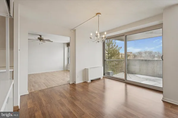 a view of a room with wooden floor wooden floor and window