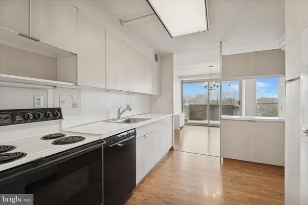a kitchen with a stove and a sink