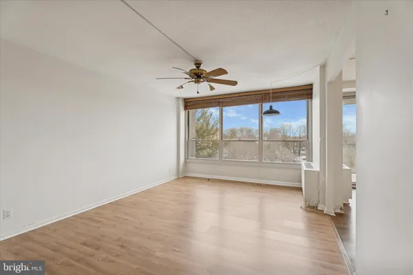 a view of an empty room with a window