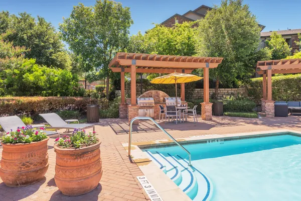 swimming pool with outdoor seating and yard
