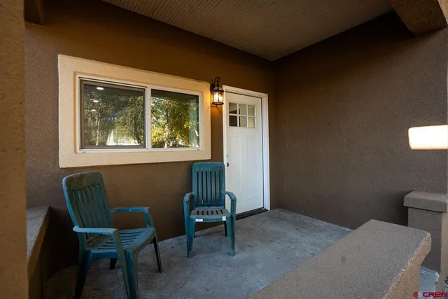 a view of room with window and wooden floor