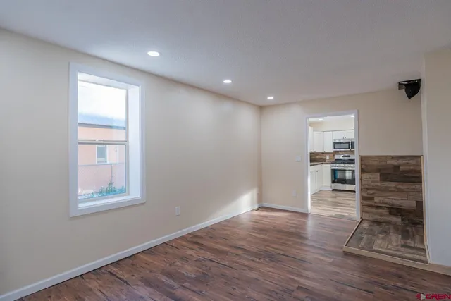 a bathroom with a walk in closet and a window
