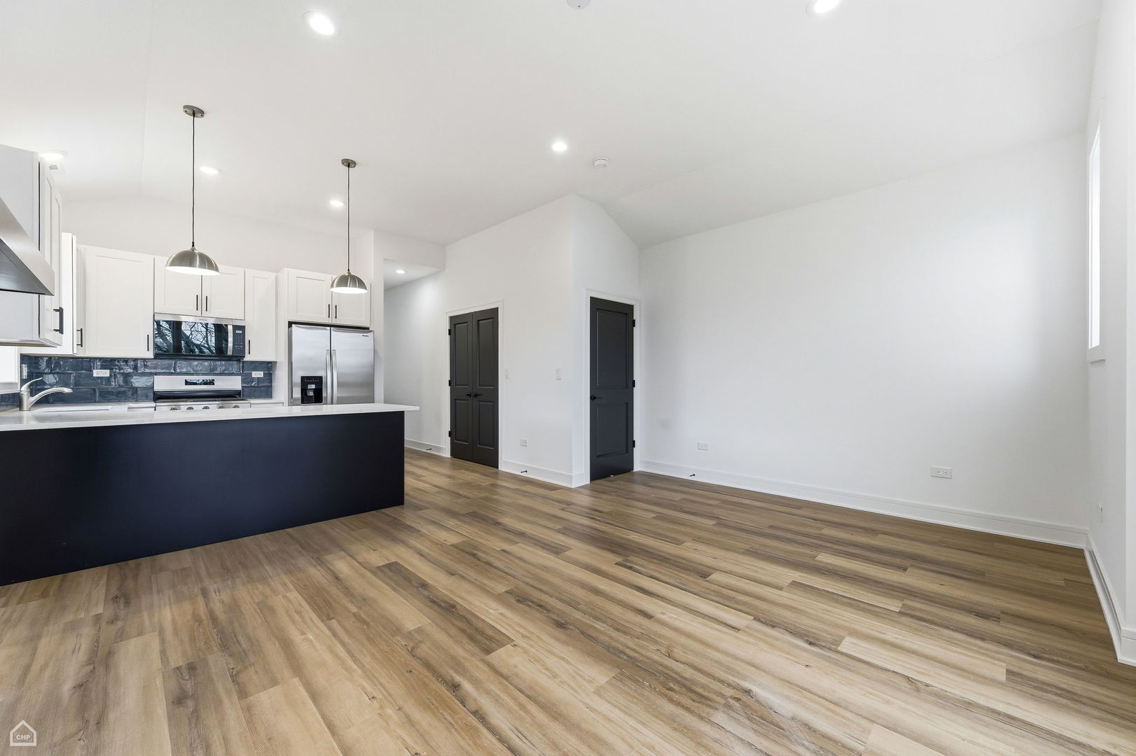 861 East 63rd Place, Unit 3 Chicago, IL 60637 - Photo 5 of 20 a view of kitchen with kitchen island sink and center island