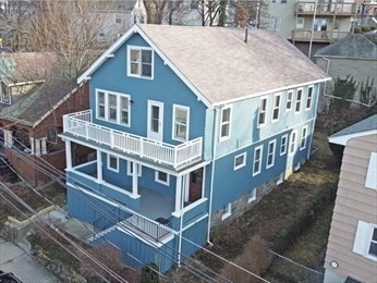 aerial view of a house with roof deck