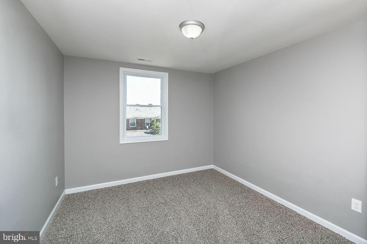3815 Yolando Road Baltimore, MD 21218 - Photo 13 of 20 an empty room with a window