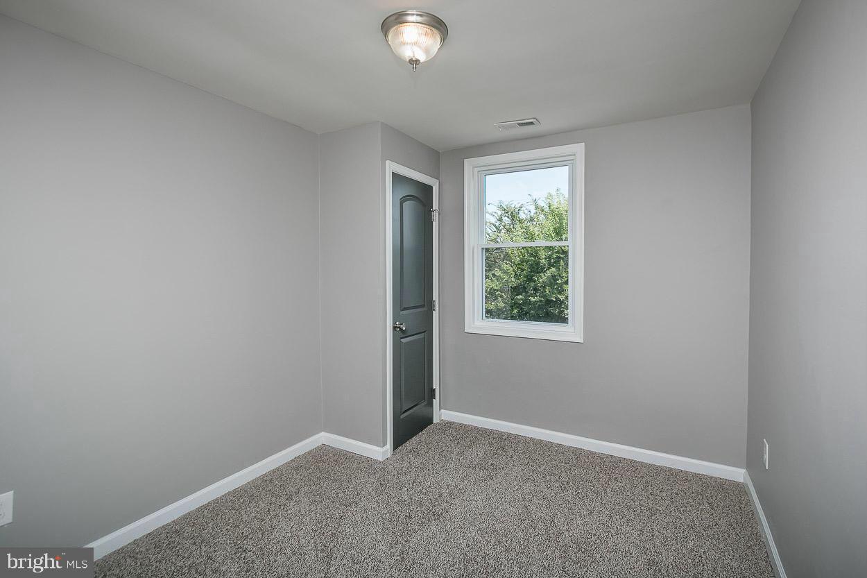 3815 Yolando Road Baltimore, MD 21218 - Photo 15 of 20 an empty room with windows