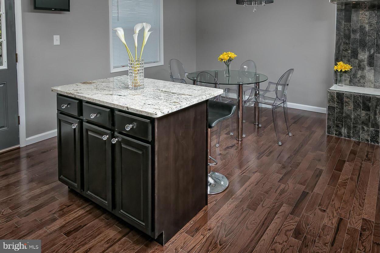 3815 Yolando Road Baltimore, MD 21218 - Photo 3 of 20 a view of a dining room with furniture and wooden floor