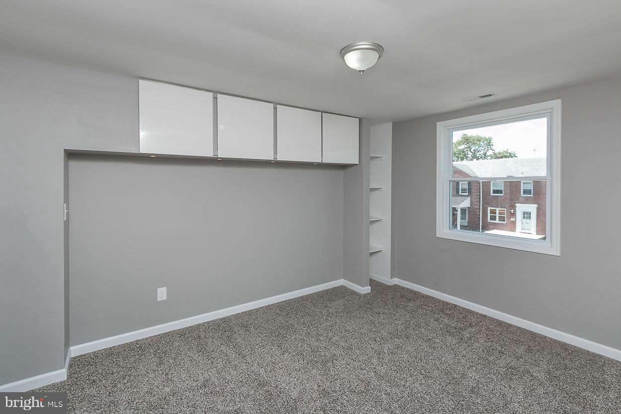 3815 Yolando Road Baltimore, MD 21218 - Photo 7 of 20 a view of an empty room with a window