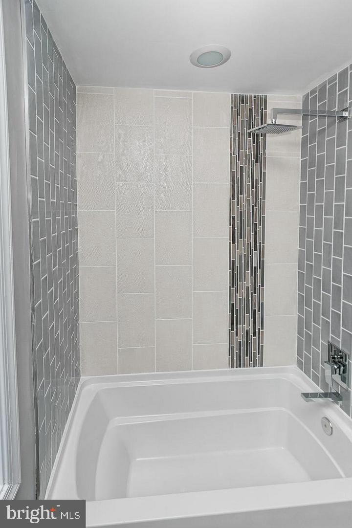 3815 Yolando Road Baltimore, MD 21218 - Photo 10 of 20 a bathroom with a shower and a bathtub