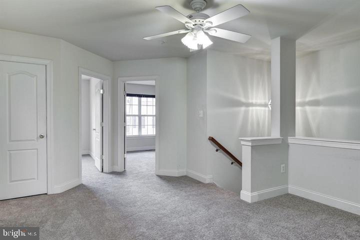 576 Orchard Ridge Drive, Unit 100 Gaithersburg, MD 20878 - Photo 14 of 44 wooden floor in an empty room with a window