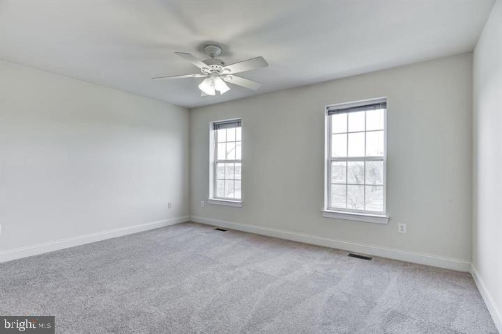 576 Orchard Ridge Drive, Unit 100 Gaithersburg, MD 20878 - Photo 15 of 44 a view of an empty room with a window