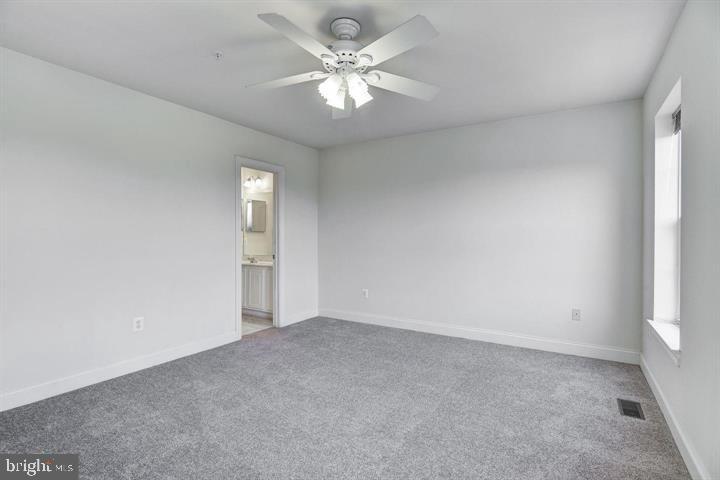 576 Orchard Ridge Drive, Unit 100 Gaithersburg, MD 20878 - Photo 16 of 44 a view of an empty room with a window