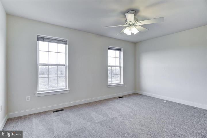 576 Orchard Ridge Drive, Unit 100 Gaithersburg, MD 20878 - Photo 17 of 44 a view of an empty room with a window