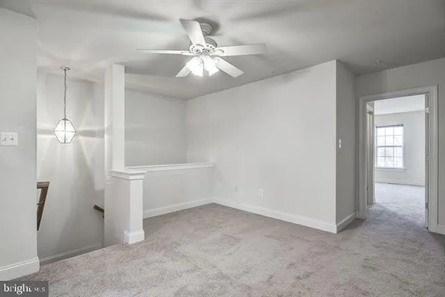 wooden floor in an empty room and a bathroom
