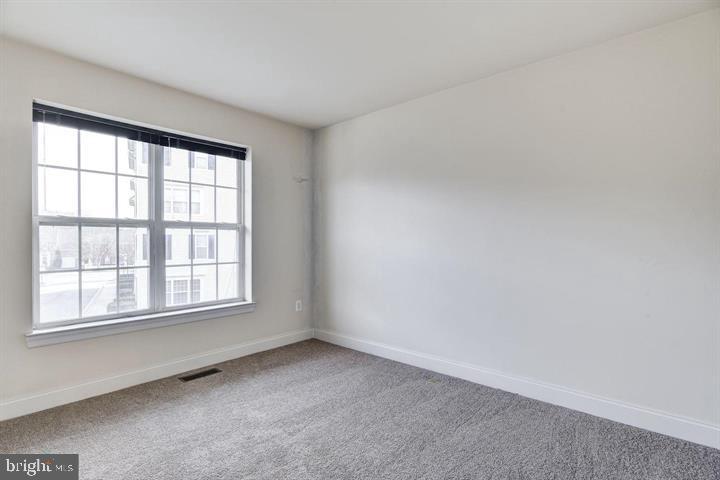 576 Orchard Ridge Drive, Unit 100 Gaithersburg, MD 20878 - Photo 22 of 44 an empty room with a window