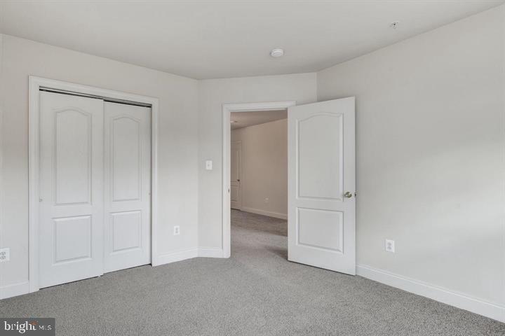576 Orchard Ridge Drive, Unit 100 Gaithersburg, MD 20878 - Photo 24 of 44 an empty room with closet area