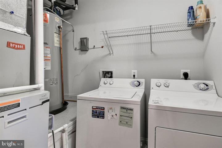 576 Orchard Ridge Drive, Unit 100 Gaithersburg, MD 20878 - Photo 30 of 44 a utility room with dryer and washer