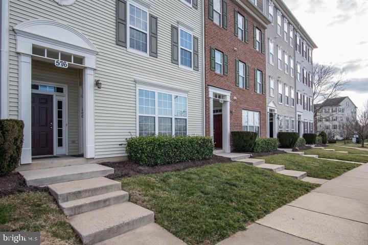 576 Orchard Ridge Drive, Unit 100 Gaithersburg, MD 20878 - Photo 34 of 44 a front view of a building with garden