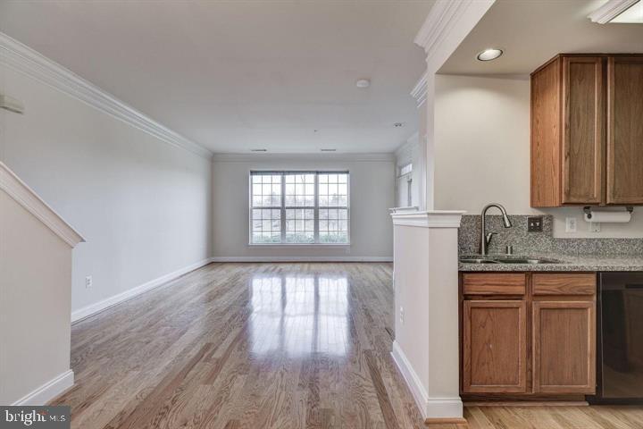 576 Orchard Ridge Drive, Unit 100 Gaithersburg, MD 20878 - Photo 10 of 44 a view of cabinets and wooden floor