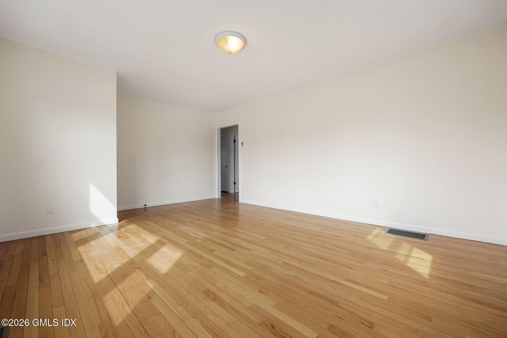 2 Grange Street Greenwich, CT 06830 - Photo 3 of 31 a view of an empty room and wooden floor
