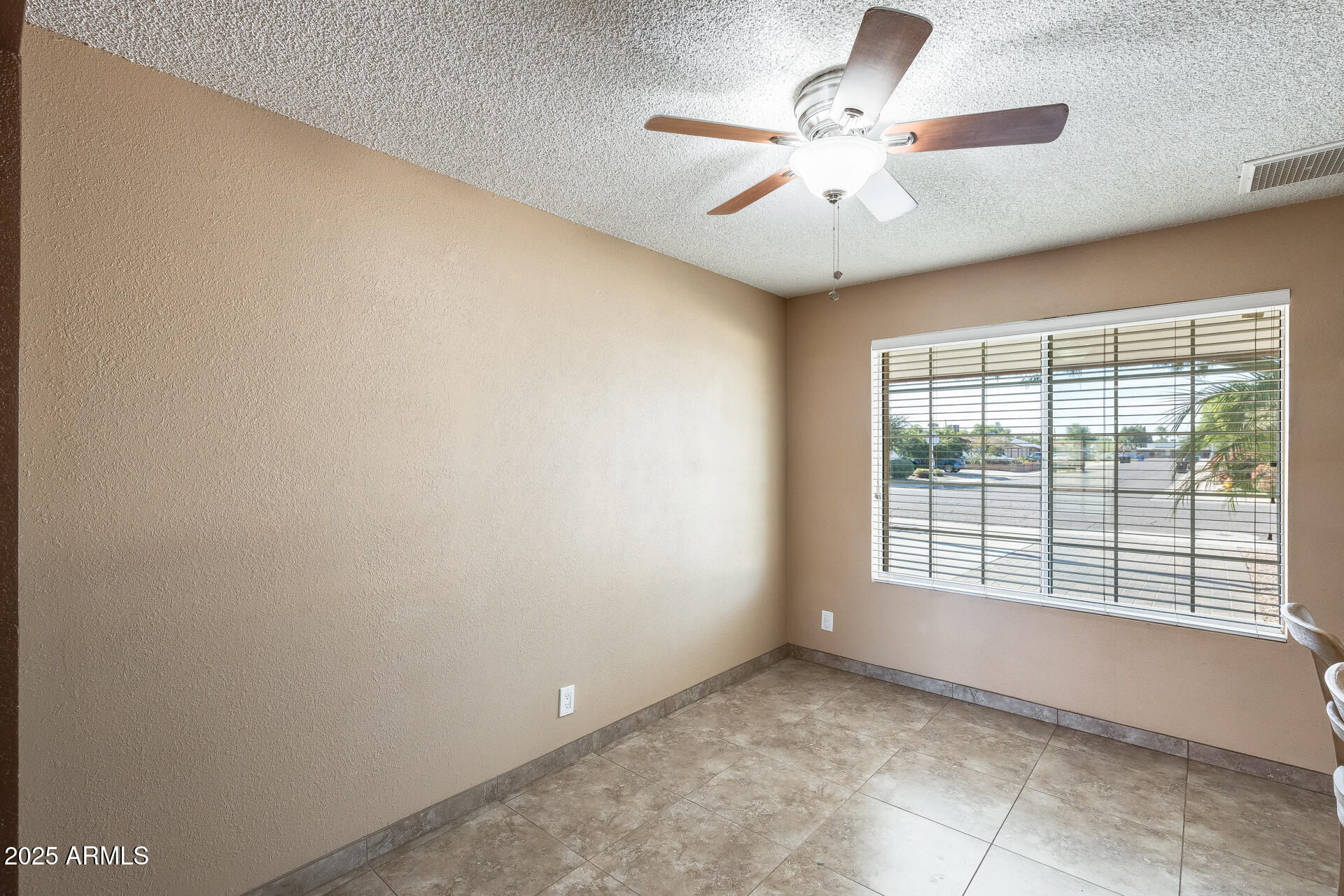 17633 North 15th Avenue Phoenix, AZ 85023 - Photo 10 of 32 a view of an empty room with a window