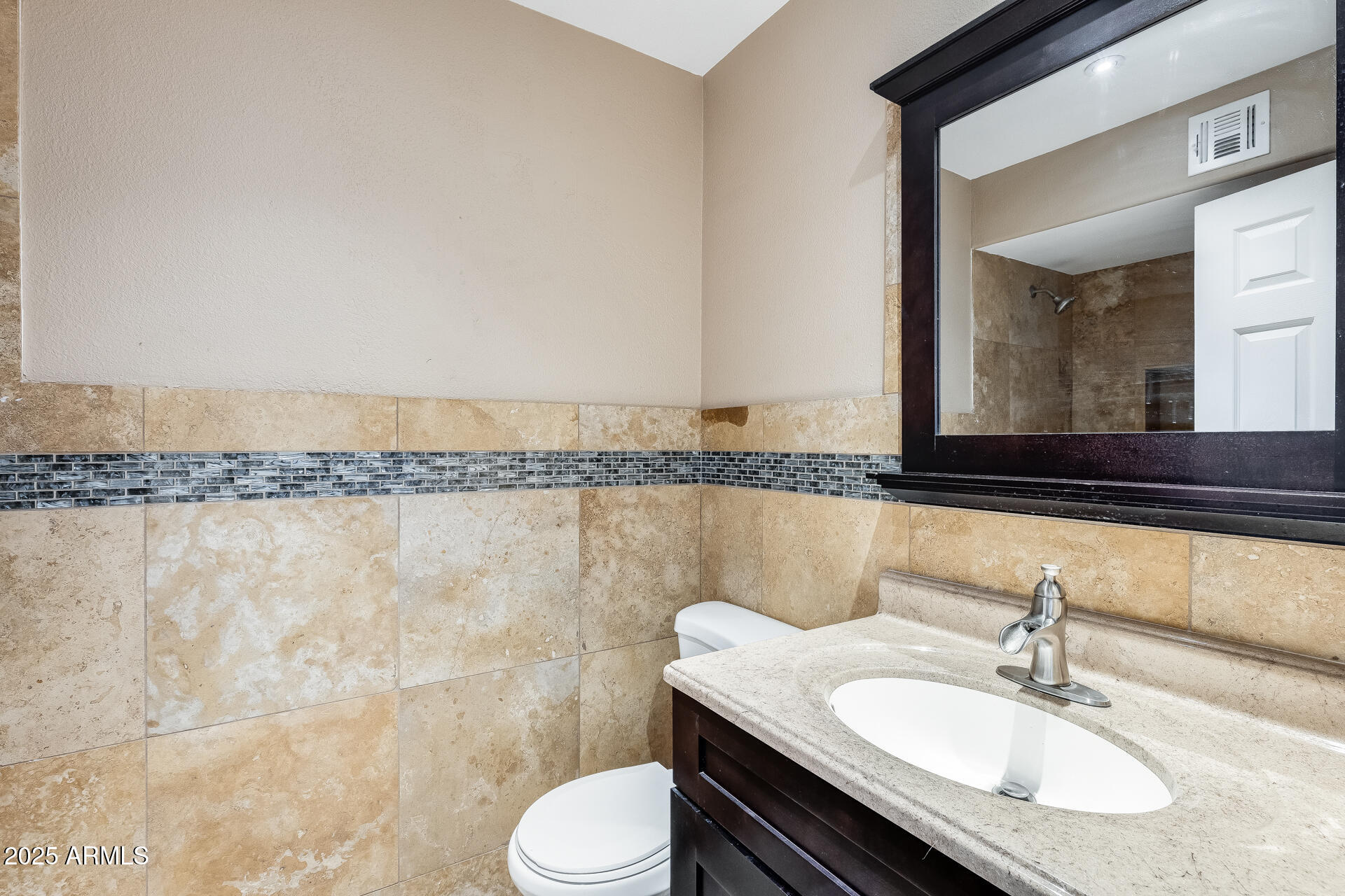 17633 North 15th Avenue Phoenix, AZ 85023 - Photo 15 of 32 a bathroom with a granite countertop bathtub sink vanity mirror and toilet