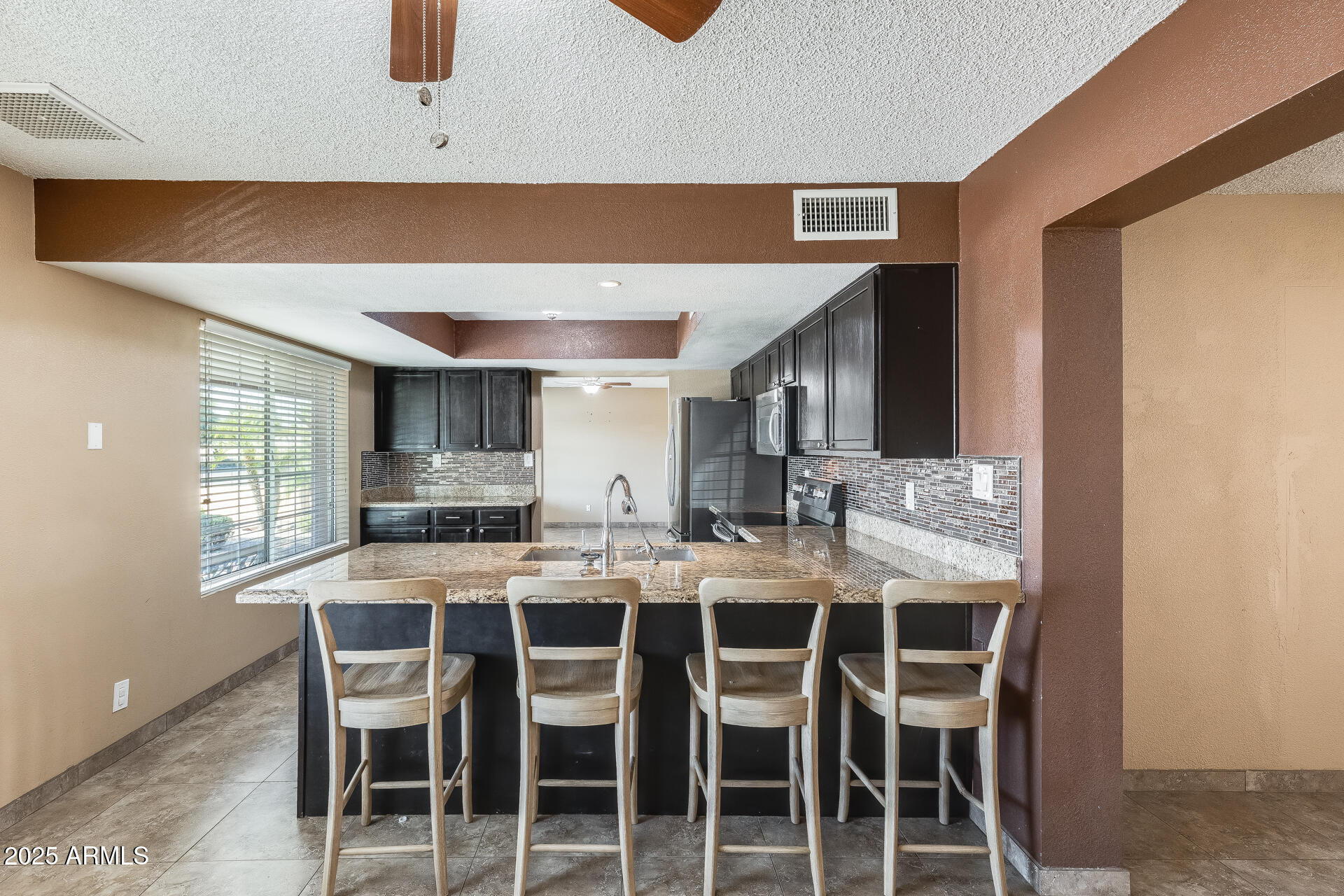17633 North 15th Avenue Phoenix, AZ 85023 - Photo 3 of 32 a dining room with furniture and window