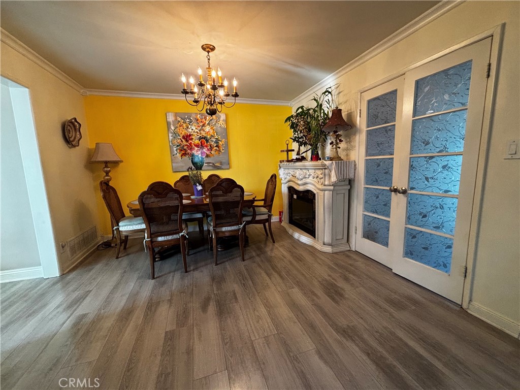5604 Tower Road Riverside, CA 92506 - Photo 19 of 70 a view of a dining room with furniture and chandelier