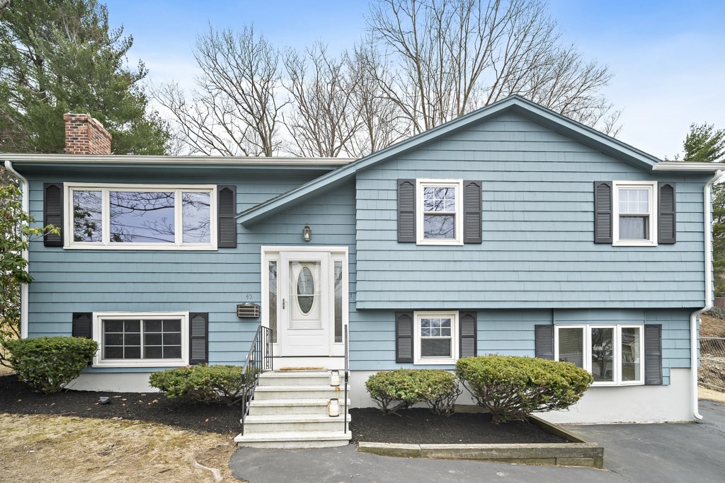 45 Brookbridge Road Stoneham, MA 02180 - Photo 1 of 34 a house that has a tree in front of the house