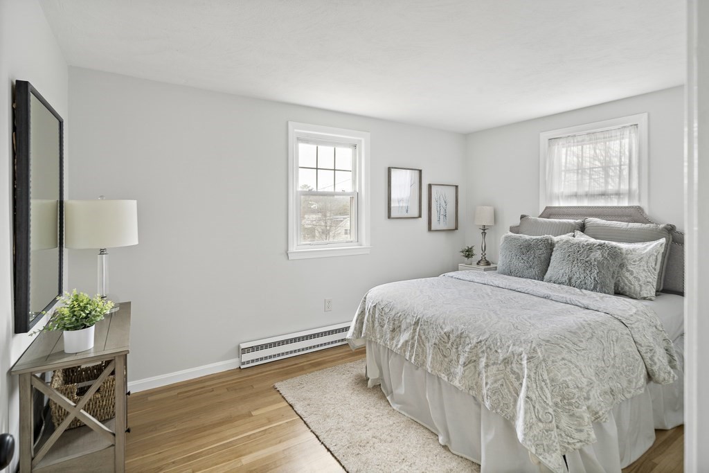 45 Brookbridge Road Stoneham, MA 02180 - Photo 12 of 34 a bedroom with a bed table and a window