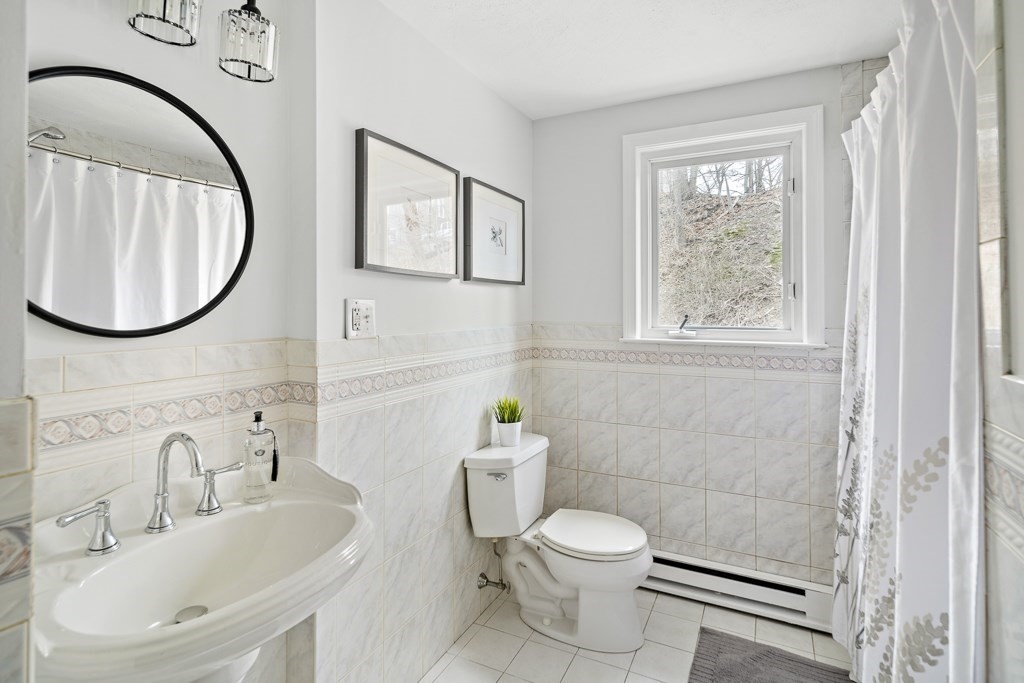 45 Brookbridge Road Stoneham, MA 02180 - Photo 14 of 34 a bathroom with a sink and a mirror