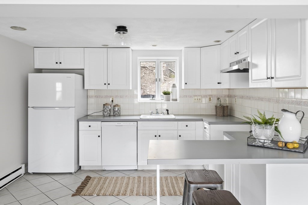 45 Brookbridge Road Stoneham, MA 02180 - Photo 20 of 34 a kitchen with a white cabinets and window