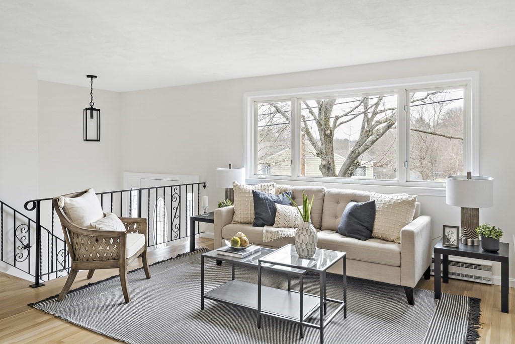 45 Brookbridge Road Stoneham, MA 02180 - Photo 2 of 34 a living room with furniture and a large window