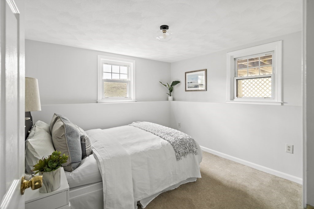 45 Brookbridge Road Stoneham, MA 02180 - Photo 22 of 34 a bedroom with a bed and window