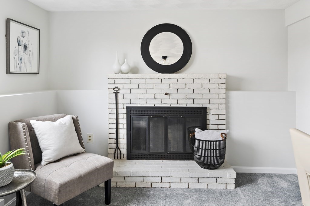 45 Brookbridge Road Stoneham, MA 02180 - Photo 24 of 34 a living room with furniture and a fireplace