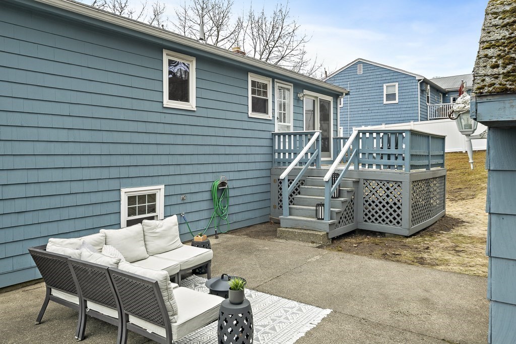 45 Brookbridge Road Stoneham, MA 02180 - Photo 29 of 34 a view of a chairs and table in the back yard of the house