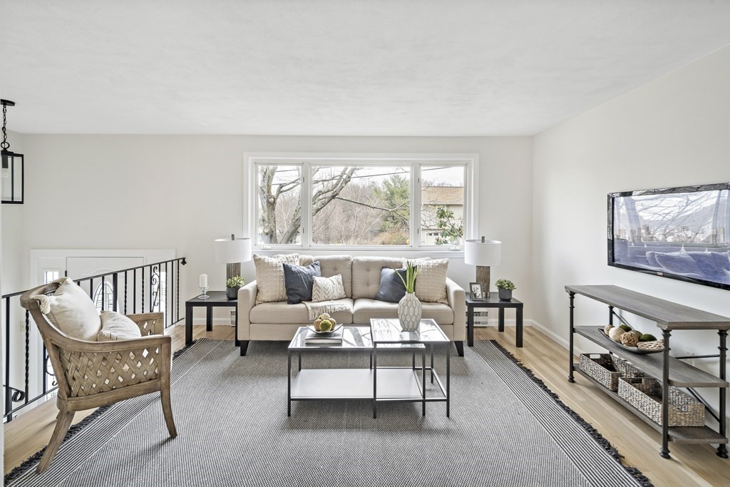 45 Brookbridge Road Stoneham, MA 02180 - Photo 3 of 34 a living room with furniture and a large window