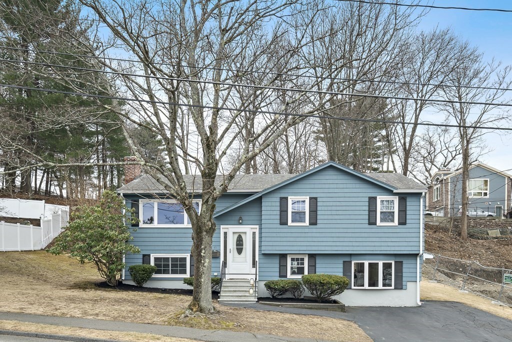 45 Brookbridge Road Stoneham, MA 02180 - Photo 31 of 34 a front view of a house with a garden