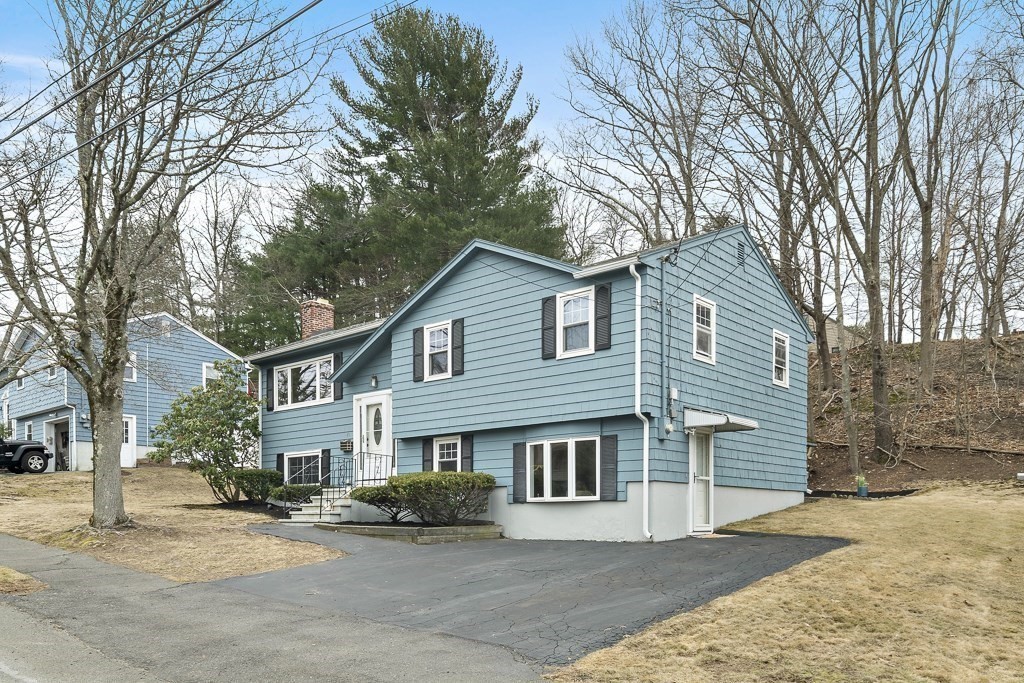 45 Brookbridge Road Stoneham, MA 02180 - Photo 32 of 34 a view of a house with a yard and large tree
