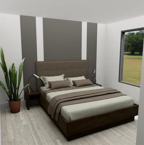 a bedroom with a bed and a potted plant