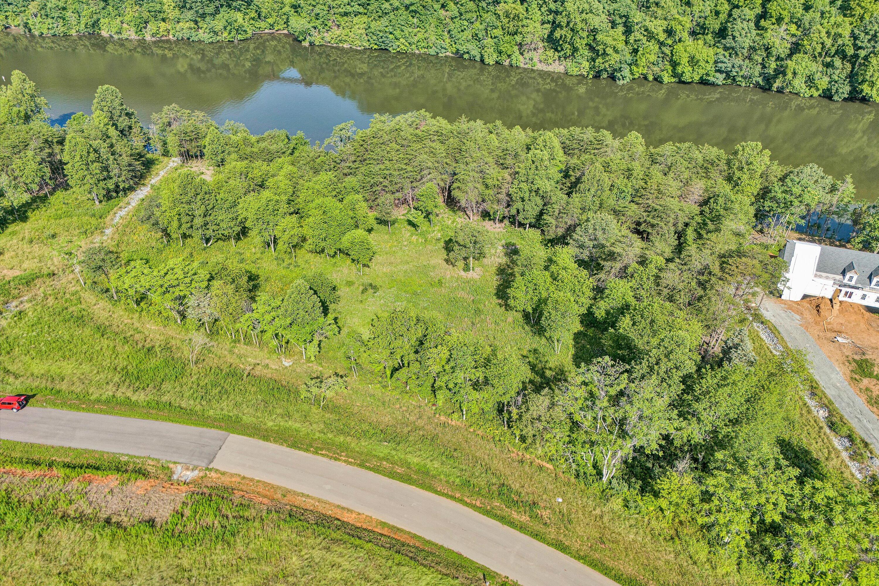 a view of a lake with a yard