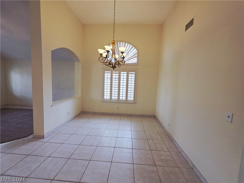2920 Setting Sun Street Las Vegas, NV 89117 - Photo 13 of 43 This bright space features tile flooring and arched architectural details, ready for your personal touch.