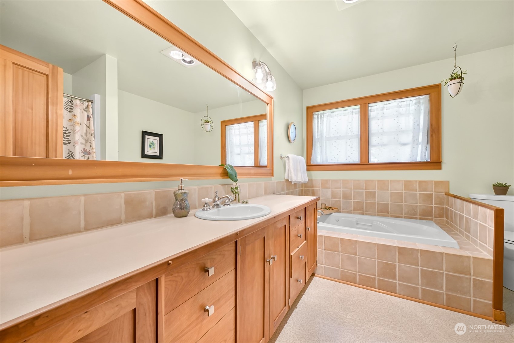 3030 Aldergrove Road Ferndale, WA 98248 - Photo 9 of 38 a bathroom with a tub a sink and a window