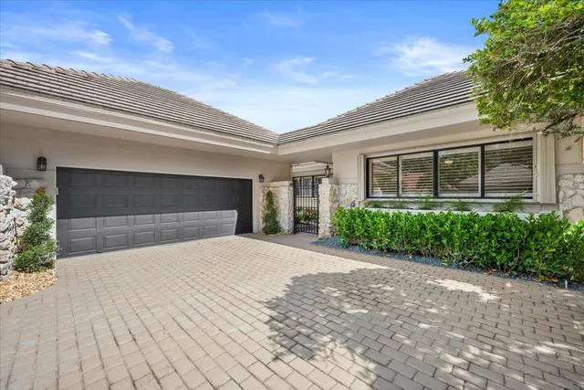 a view of a house with a flower plants