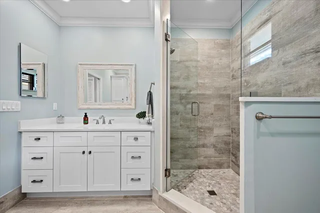 a spacious bathroom with a double vanity sink and mirror