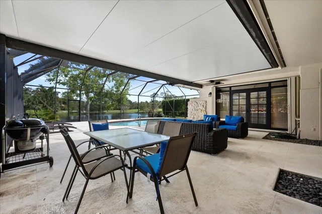 a view of a swimming pool with a patio