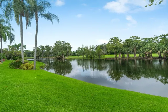 a view of a golf course with a lake